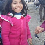 Refugee kid smiling in Lesvos, Greece