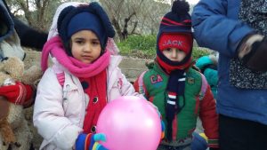Refugees kids playing balloon in Lesvos, Greece