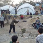 Refugees playing ball in Moria camp in Lesvos, Greece